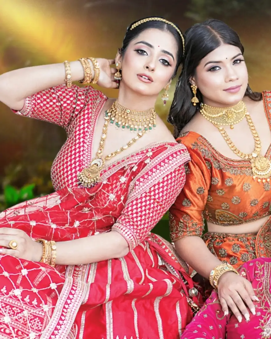 Two brides wearing ARA gold bridal jewellery